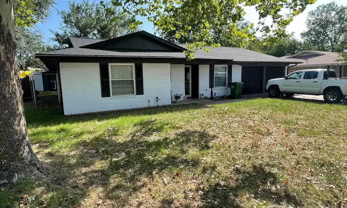 Professional roofing crew working on a residential roof in Broadalbin